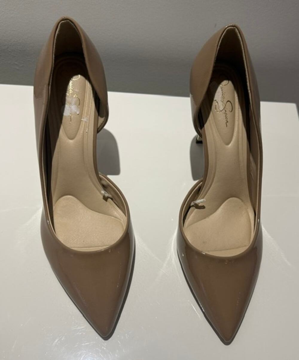 Beige patent finish pumps by Jessica Simpson.